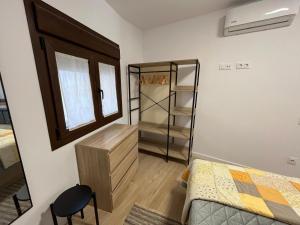 a small bedroom with a bed and a closet at Casa Bertolo in Radiquero