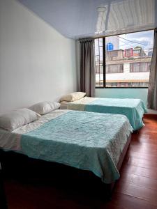 Postel nebo postele na pokoji v ubytování Kuyay Yachi Hostel