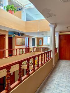 a lobby with a staircase with a skylight at Hospedaje Anais in Pisco +55 photos