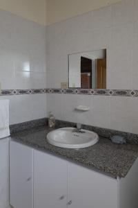 a bathroom counter with a sink and a mirror at Finca campestre de 2 pisos en Guarne in Guarne +50 photos