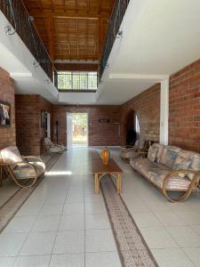 a living room with a couch and a table at Finca campestre de 2 pisos en Guarne in Guarne