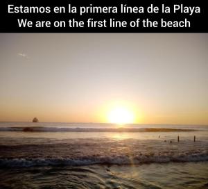 an island sunset on the beach with the wordsfamous en la primera linea at Vista del Mar in Acajutla