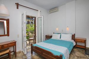 Un pat sau paturi într-o cameră la Hotel Anelli