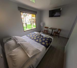 Letto o letti in una camera di Hotel Divasto