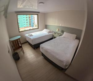 Letto o letti in una camera di Hotel Divasto