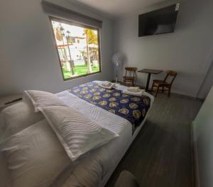Letto o letti in una camera di Hotel Divasto