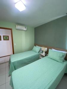 Voodi või voodid majutusasutuse Iloa Flat Resort Apt 207 bloco H toas +17 fotot