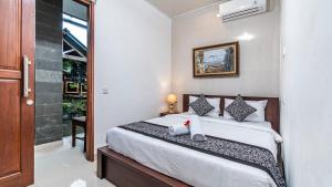 Postel nebo postele na pokoji v ubytování Teba Kauh Ubud