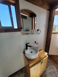 a bathroom with a sink on a wooden counter at Domo Tunquen in Tunquén +57 photos