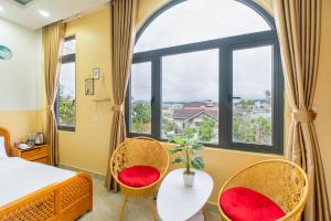 Postel nebo postele na pokoji v ubytování Violet villa and Coffee