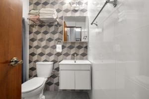 a bathroom with a toilet and a sink and a shower at Old San Juan "best Place I've Ever Stayed" in San Juan +25 photos