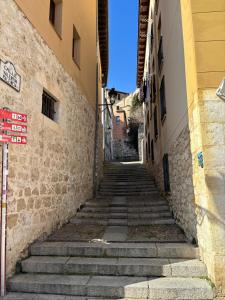 an alley in an old town with steep stairs at VISTA GÓTICA CATEDRAL BURGOS Spain in Burgos