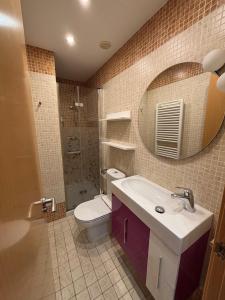 a bathroom with a sink and a toilet and a mirror at VISTA GÓTICA CATEDRAL BURGOS Spain in Burgos +12 photos