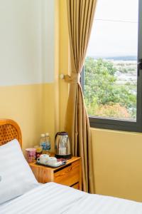 Postel nebo postele na pokoji v ubytování Violet villa and Coffee + 2 fotografie