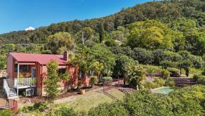 an aerial view of a house with a pool and trees at Bimbadeen Estate Villa 1 in Mount View