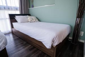 Postel nebo postele na pokoji v ubytování ORI Nipponbashi