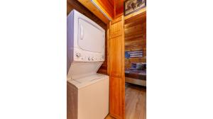 a refrigerator and a tv in a room at Dream Circle in Bryson City +51 photos