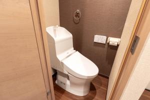 a bathroom with a white toilet in a room at Ostay Ikebukuro Dairaku Hotel Apartment in Tokyo