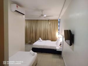 Sunsega Hotel客房内的一张或多张床位