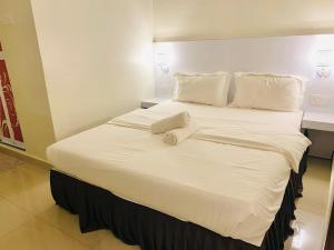 Sunsega Hotel客房内的一张或多张床位