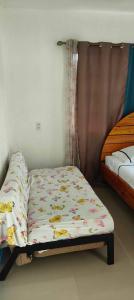 Postel nebo postele na pokoji v ubytování Saki's inn