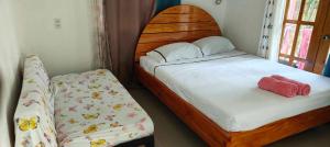 Postel nebo postele na pokoji v ubytování Saki's inn
