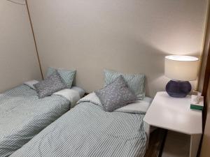 Katil atau katil-katil dalam bilik di 大阪三姐妹天下茶屋館 Three Sisters Lodge -Tengachaya