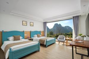 Letto o letti in una camera di Whispering Retreat