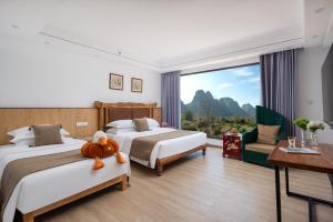 Letto o letti in una camera di Whispering Retreat