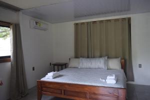 Postel nebo postele na pokoji v ubytování Coconut Lodge Pavones