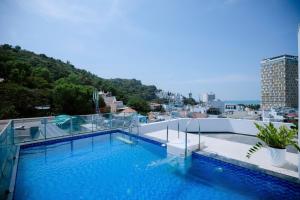 a large swimming pool on the roof of a building at Blue Sea Luxury Hotel & Apartment Vũng Tàu in Vung Tau