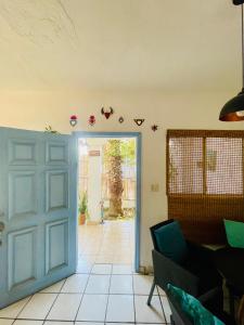 an open door to a living room with a couch at Casa Kante centro histórico 2bed 2Bath parking in San José del Cabo