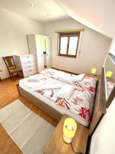 a bedroom with a large bed in a room at Apartment Eli Kacjak in Dramalj