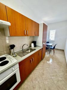 Kuchyň nebo kuchyňský kout v ubytování Apartman & rooms Draga