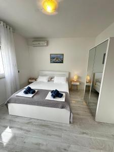 Postel nebo postele na pokoji v ubytování Apartman & rooms Draga