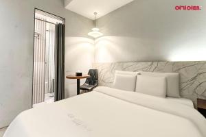 Postel nebo postele na pokoji v ubytování Hotel Yaja Terminal Branch