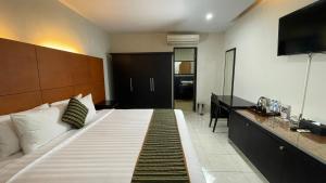 Krevet ili kreveti u jedinici u okviru objekta LPP Convention Hotel Demangan