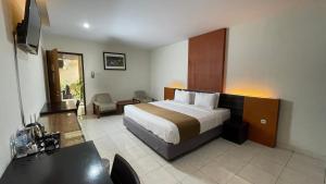 Krevet ili kreveti u jedinici u okviru objekta LPP Convention Hotel Demangan
