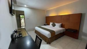 Krevet ili kreveti u jedinici u okviru objekta LPP Convention Hotel Demangan