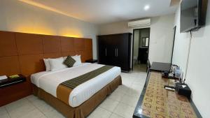 Krevet ili kreveti u jedinici u okviru objekta LPP Convention Hotel Demangan
