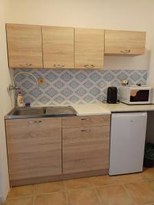 Kuchyňa alebo kuchynka v ubytovaní Apartmán Bokova chata