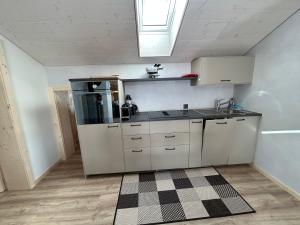 A kitchen or kitchenette at Alpenchalet Haldeli Ferienwohnung