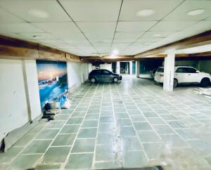 an empty parking garage with cars parked in it at Mewar Lodge in Varanasi