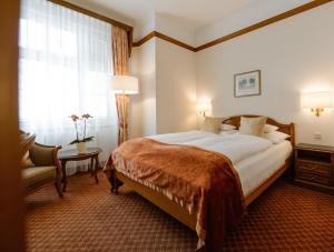 Postel nebo postele na pokoji v ubytování Hotel City Central
