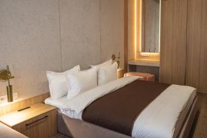 Postel nebo postele na pokoji v ubytování DOM hotel