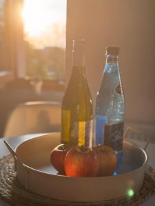 two bottles of soda and apples on a table at Wielkopolska 22 in Szczecin +8 photos