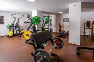 a gym with several exercise bikes in a room at Sportschule Werdau in Werdau +31 photos