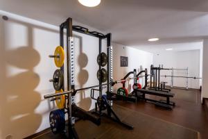 a gym with several tread machines in a room at Sportschule Werdau in Werdau