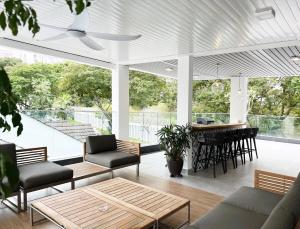 a living room with a couch and a table at Villa Homescape, Mont Kiara in Kuala Lumpur