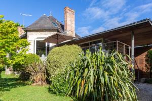 a house with a plant in front of it at Maison De Kerobistin - plage à 150m in Combrit
